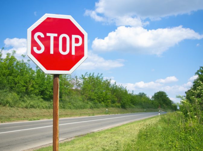 Stop,Sign,By,The,Empty,Road