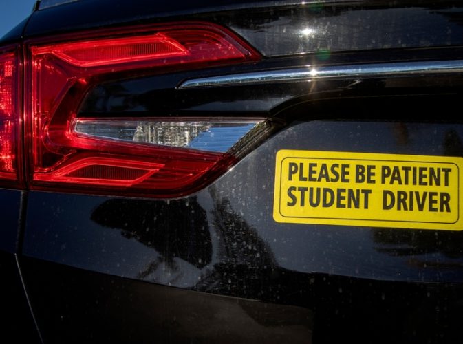 Yellow,Student,Driver,Bumpersticker,On,Black,Car